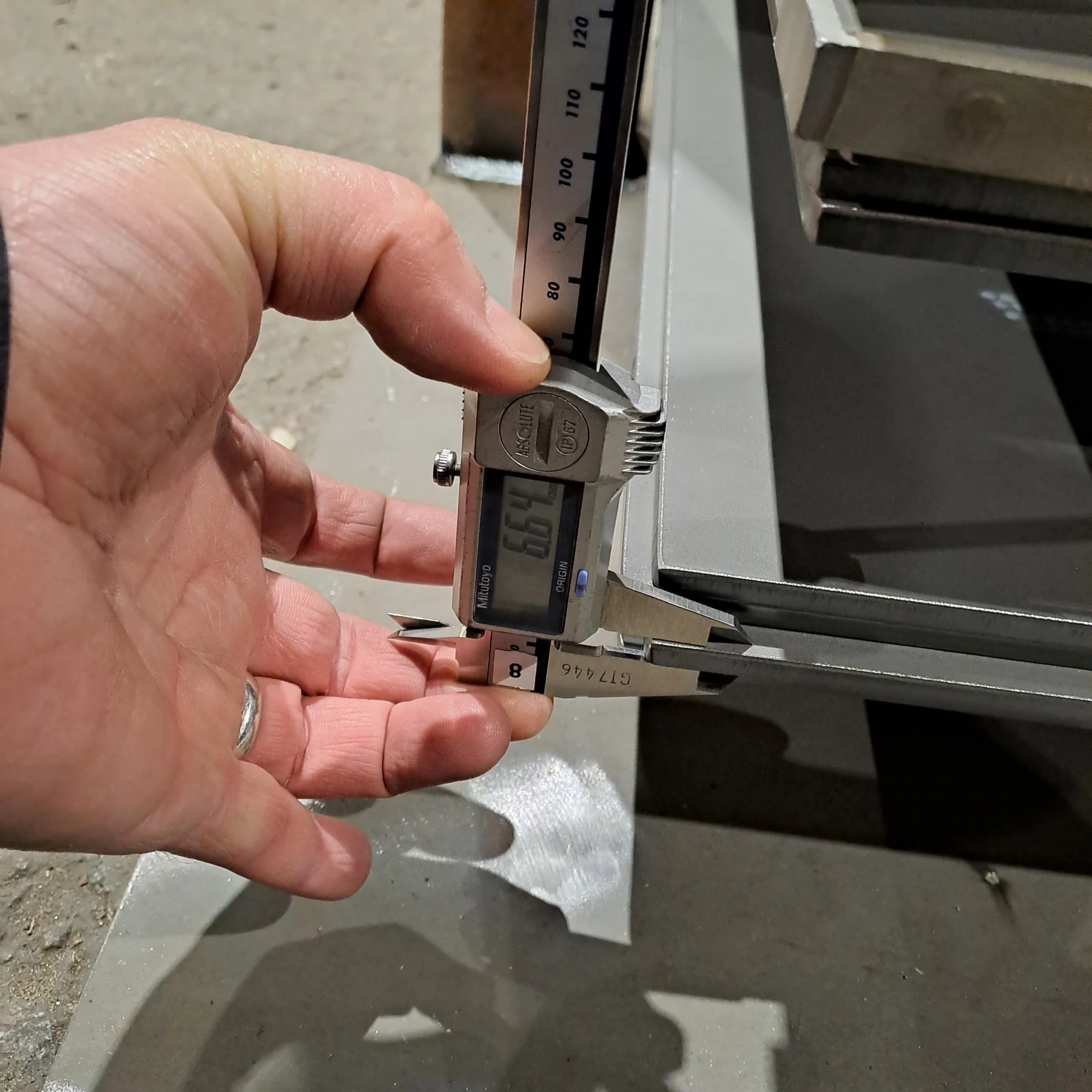 Caliper measurement on fabricated steel item