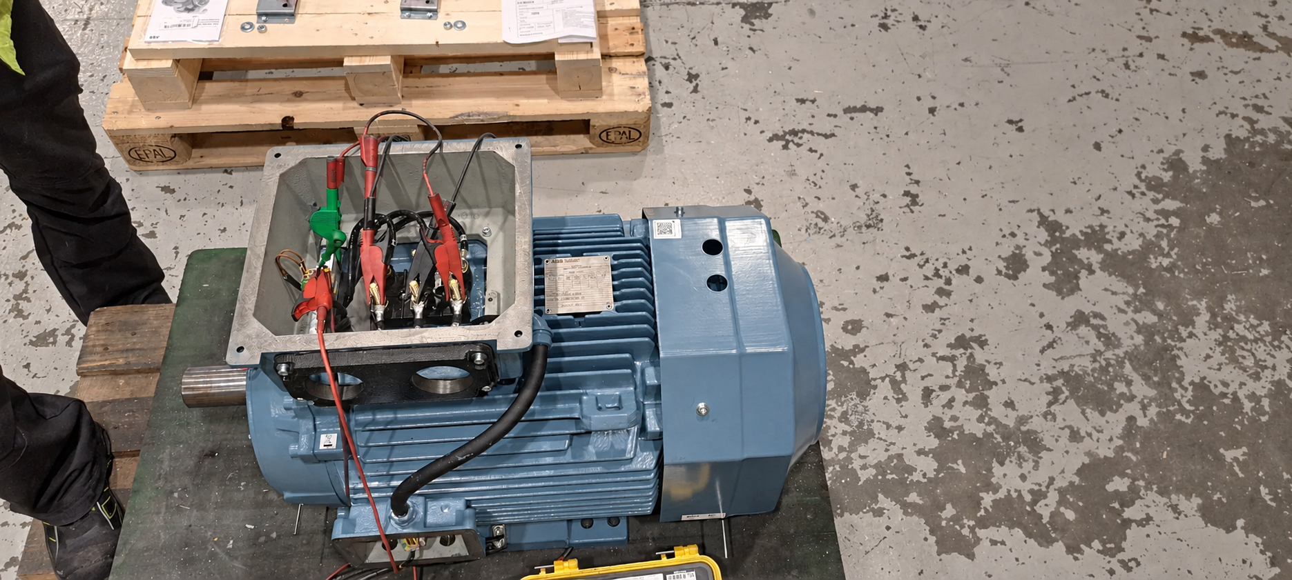 Test leads connected to an industrial motor terminal box for bearing RTD and rotor winding resistance measurements